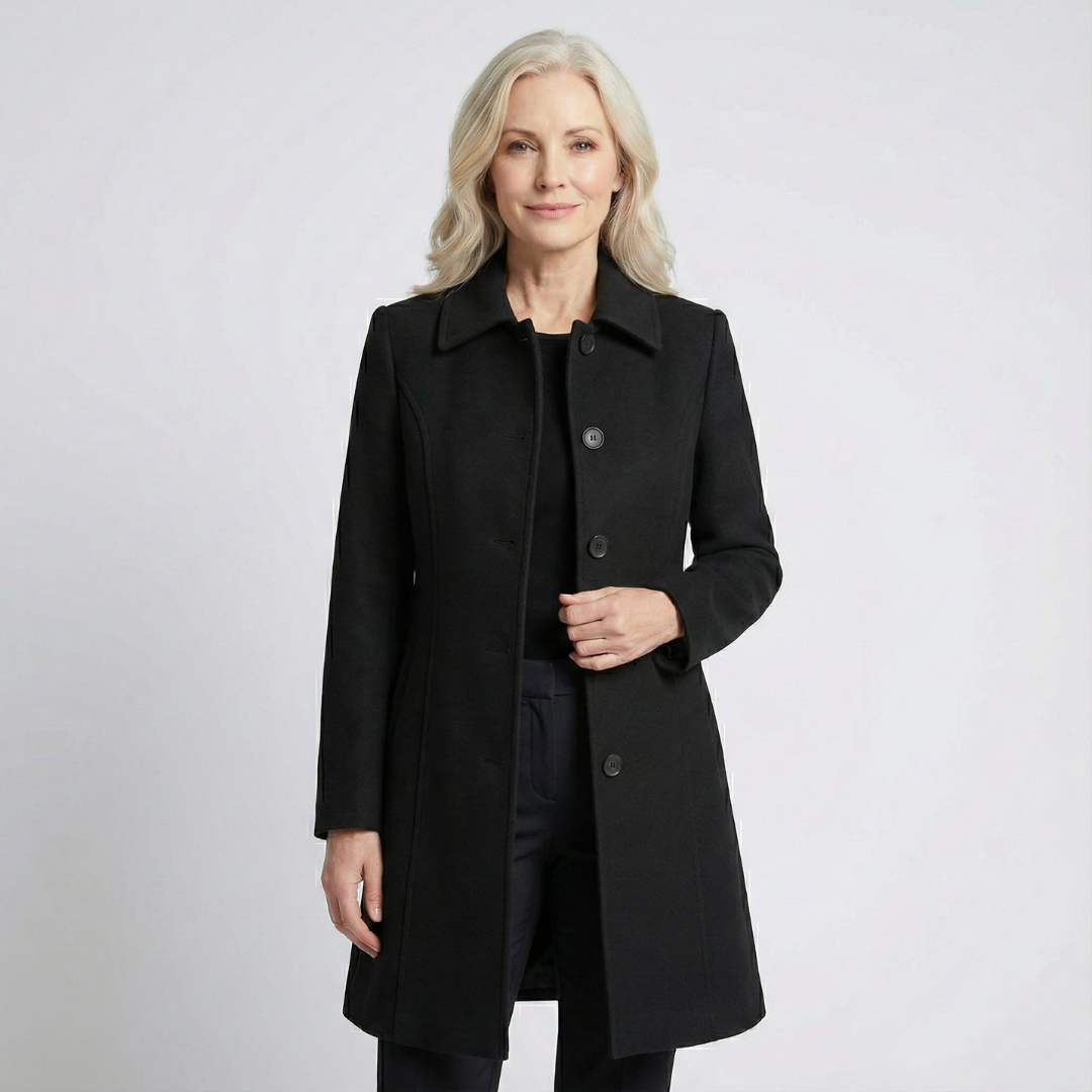 Woman wearing black fit and flare wool coat with point collar