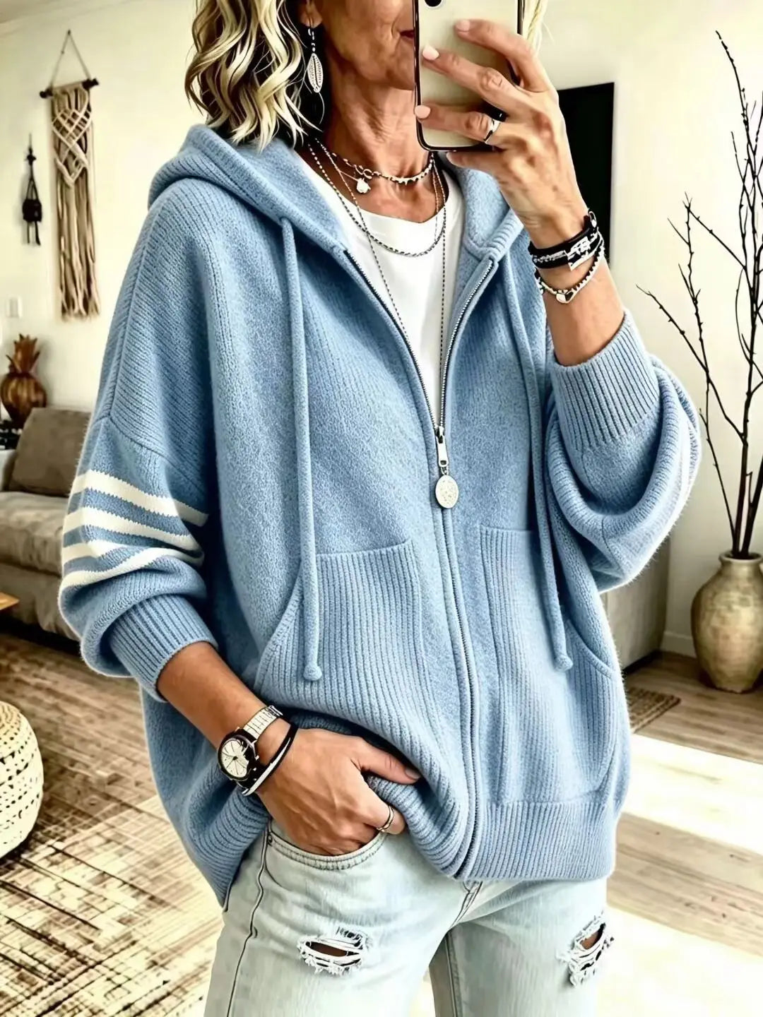 Light blue zip-up knit hoodie with striped sleeve panel