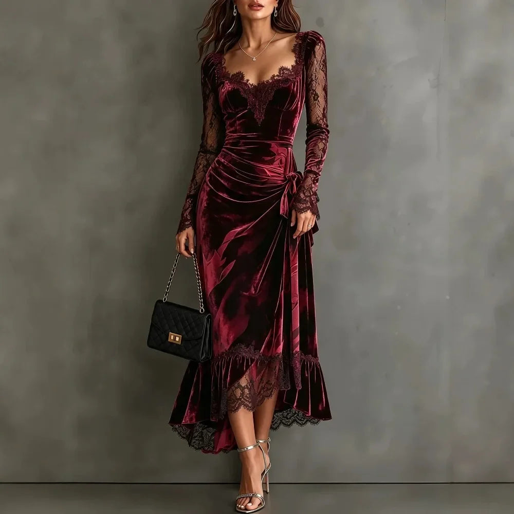 Woman wearing dark red velvet maxi dress with lace sweetheart neckline and tie waist, front view