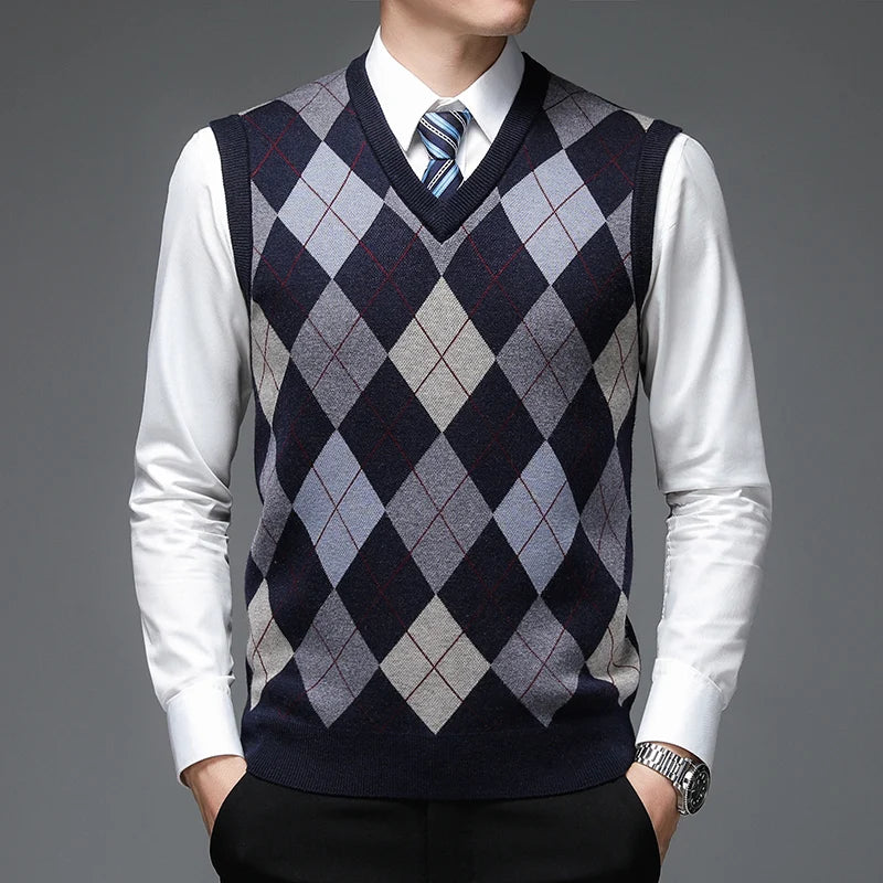 Man wearing navy argyle sweater vest over white shirt