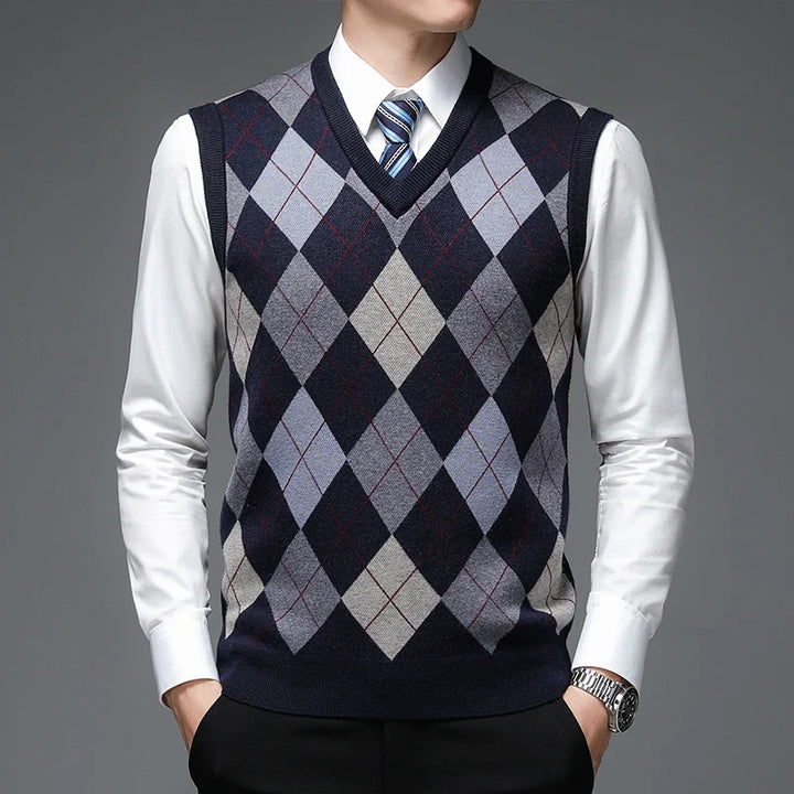 Man wearing navy argyle sweater vest over white shirt