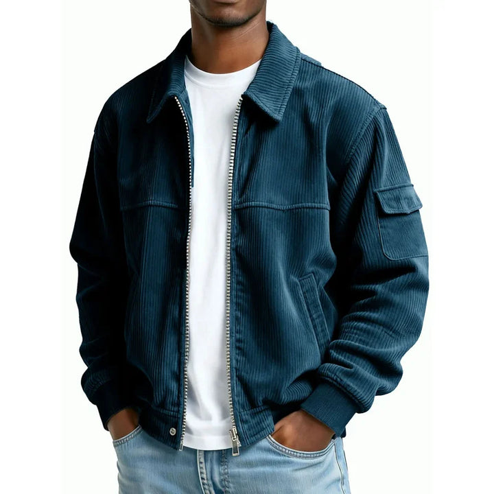 Man wearing navy blue corduroy zip jacket with flap pocket