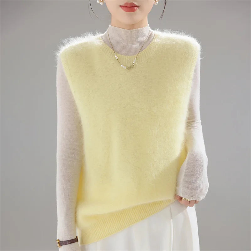 Yellow brushed knit sweater vest worn over cream turtleneck