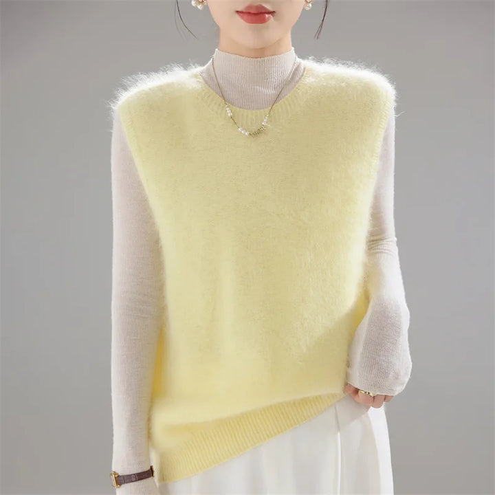 Yellow brushed knit sweater vest worn over cream turtleneck