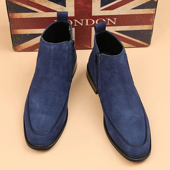 Pair of blue suede Chelsea boots front view