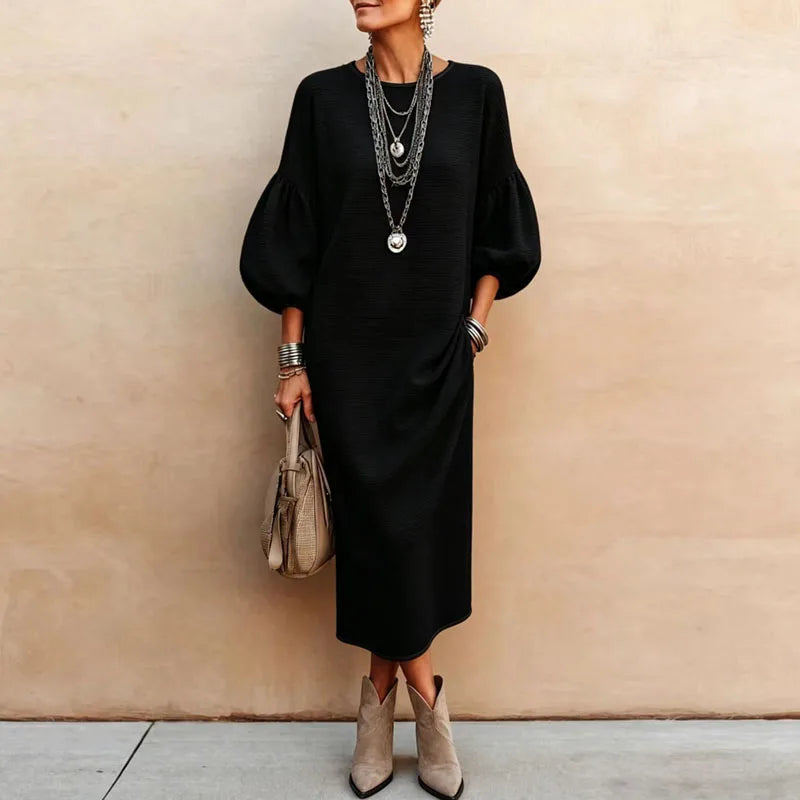 Black knit maxi dress with lantern sleeves and loose silhouette