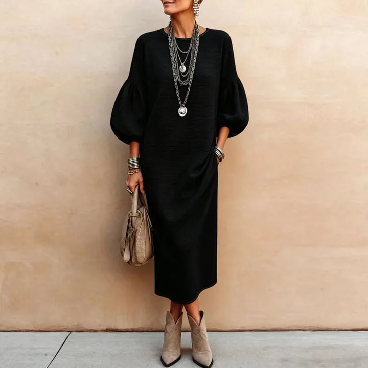Black knit maxi dress with lantern sleeves and loose silhouette