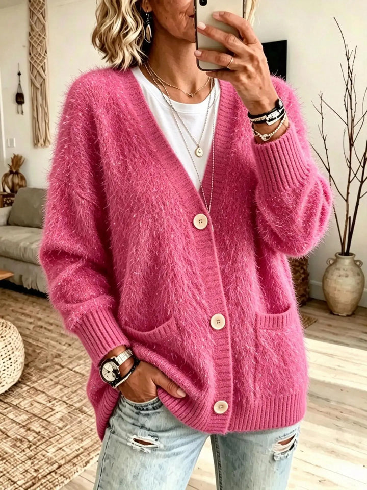 Close up of rose red eyelash-knit cardigan with button closure