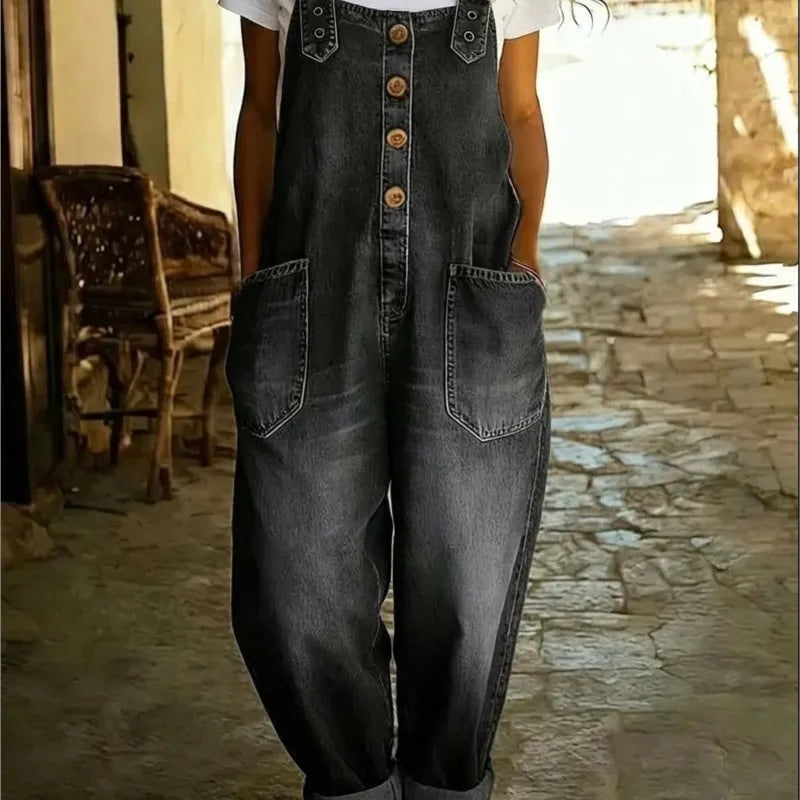 Dark wash denim bib overalls with button front and side pockets