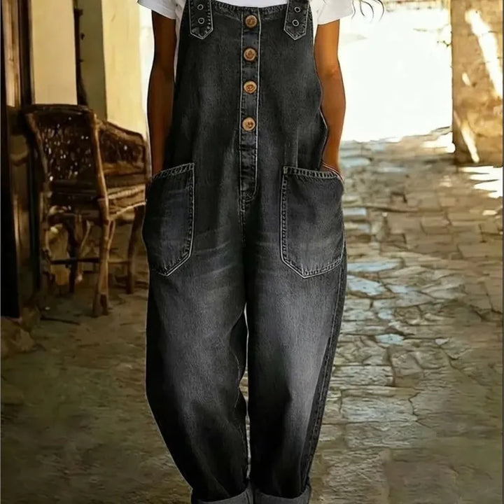 Dark wash denim bib overalls with button front and side pockets