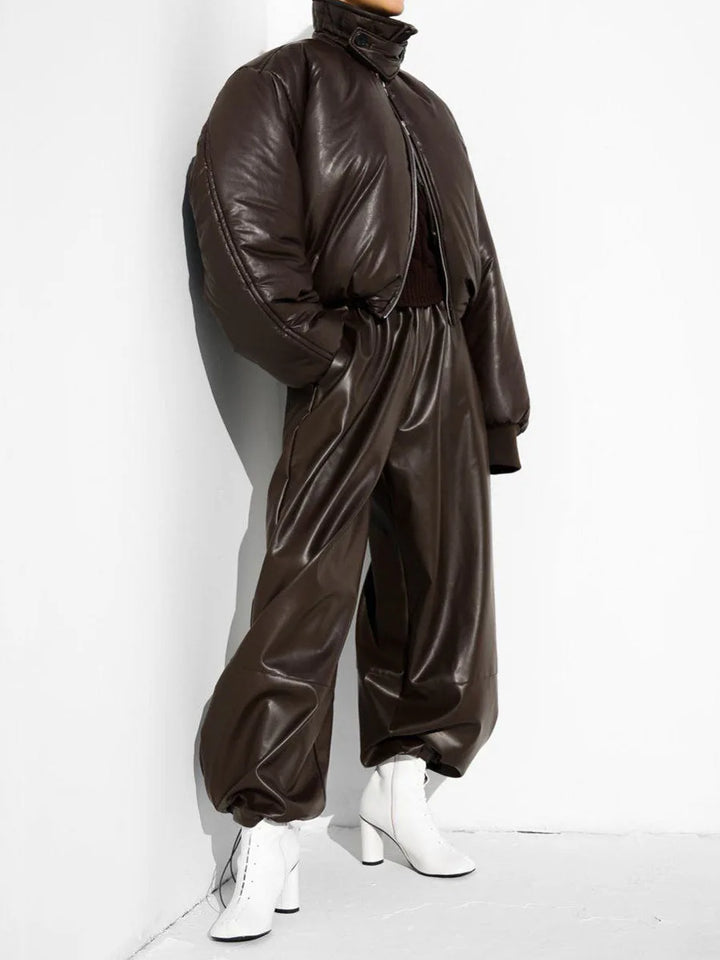 Side view of dark brown faux leather lantern pants with matching puffer jacket