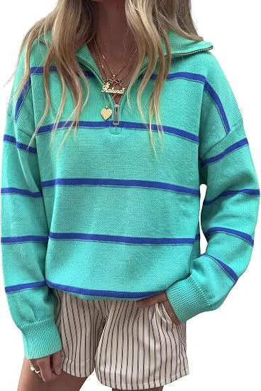 Woman wearing teal and blue striped quarter-zip sweater