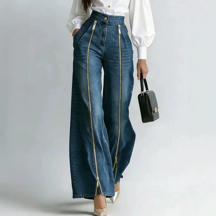 Woman wearing high waist wide leg jeans with gold zipper detail, front view