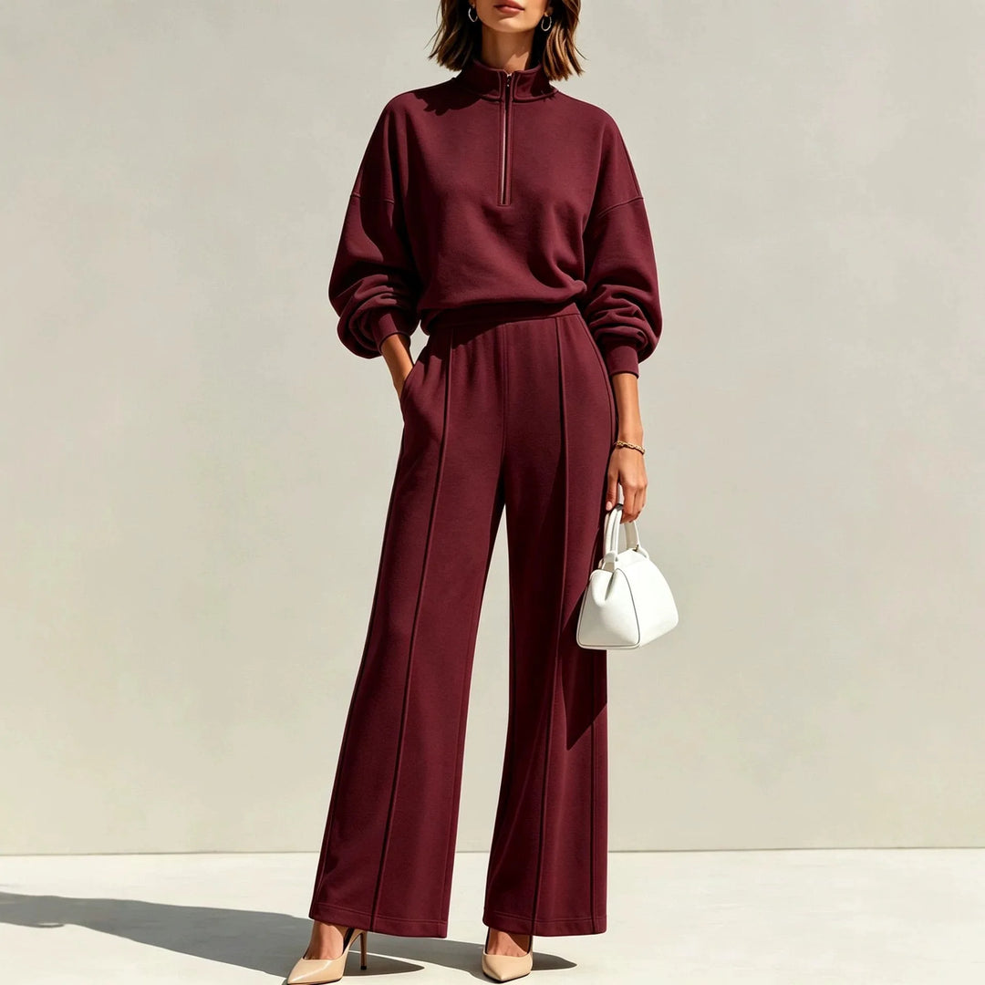 Woman wearing burgundy half zip pullover and wide leg pants set