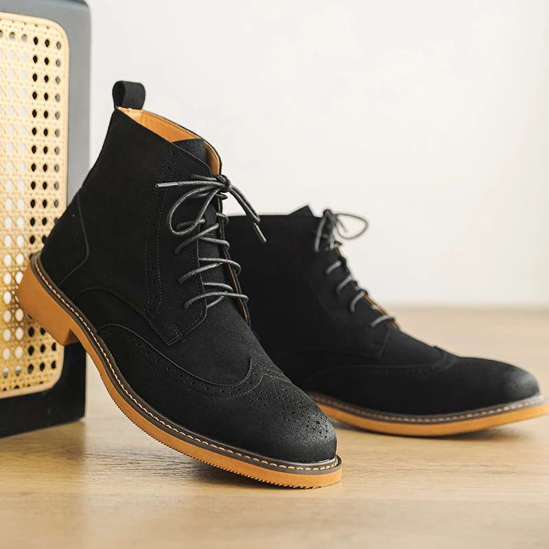 Black faux suede wingtip brogue ankle boots beside woven decor