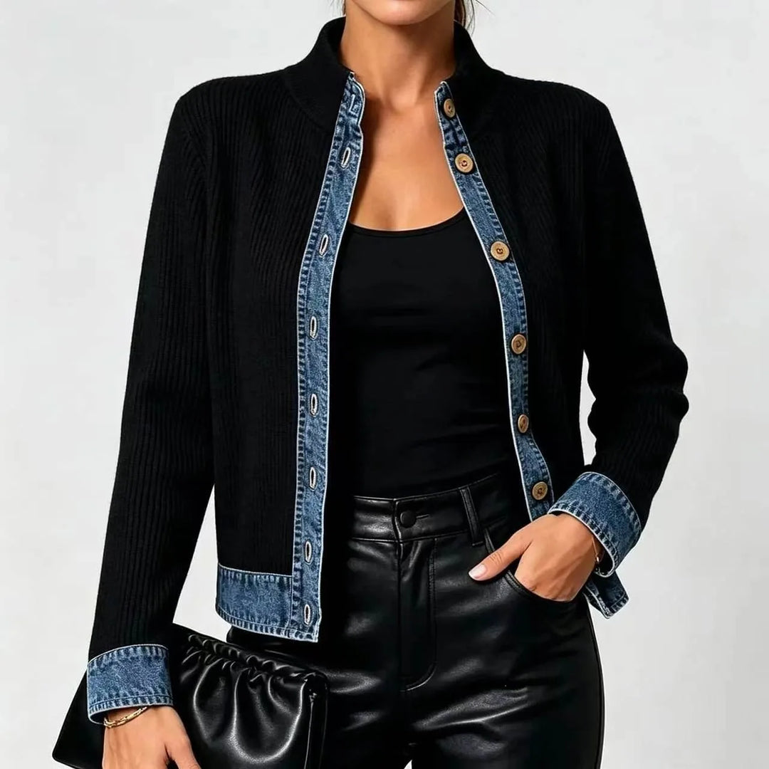 Close view of black cardigan denim button placket and cuff