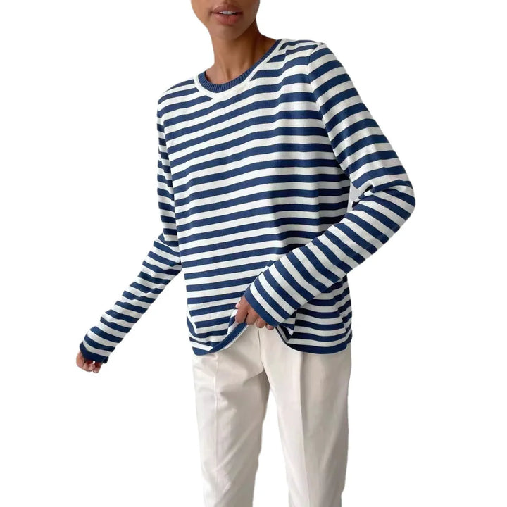 Woman wearing blue and white striped knit sweater on white background