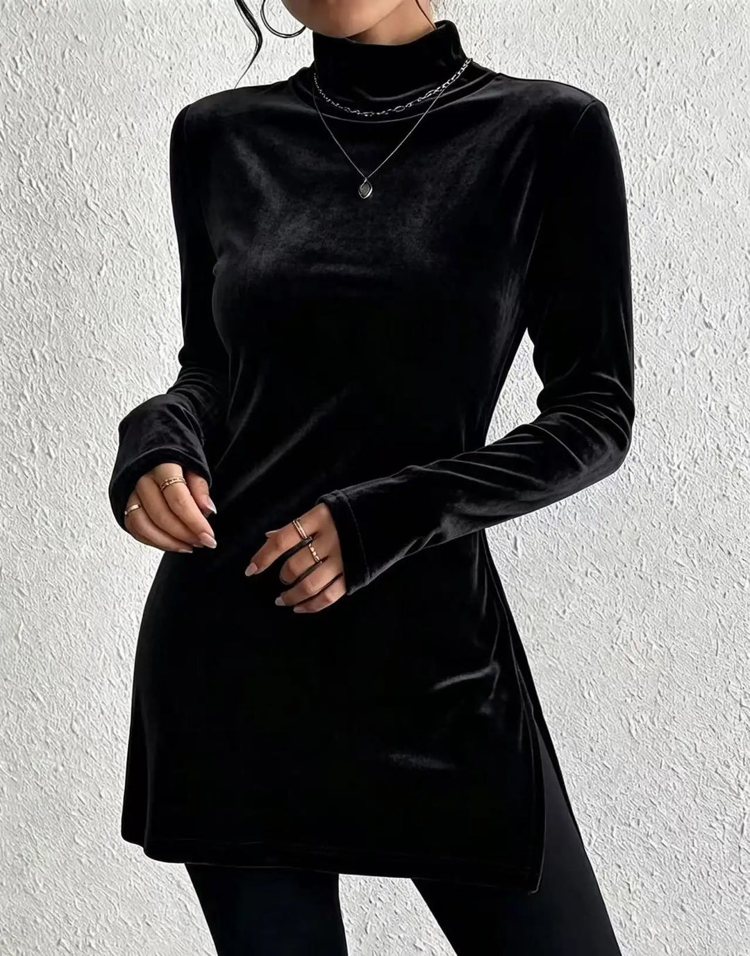 Woman wearing black velvet mock turtleneck long sleeve top