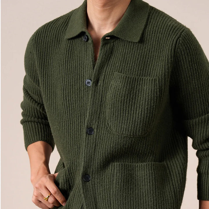 Close-up of army green ribbed knit cardigan with chest pocket and buttons