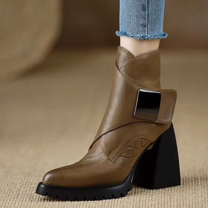 Khaki ankle boot with buckle strap, front view on model