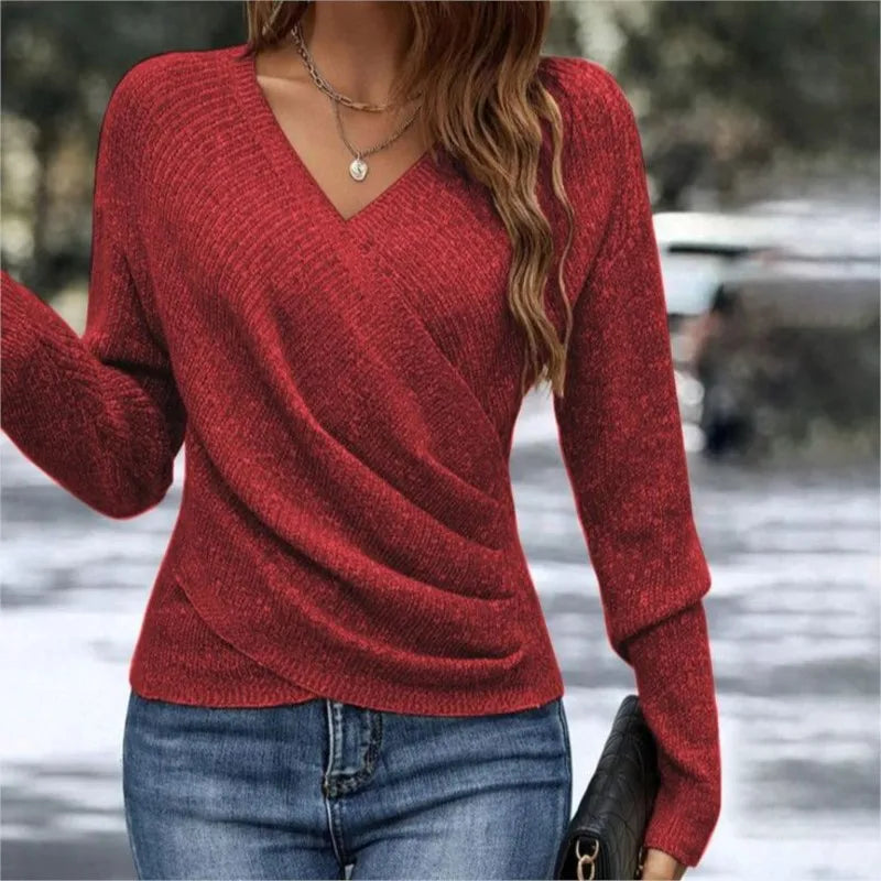 Woman wearing red ribbed knit wrap-front sweater with V-neck