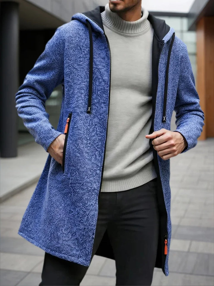 Man wearing blue heather hooded mid-length fleece jacket with zipper pocket