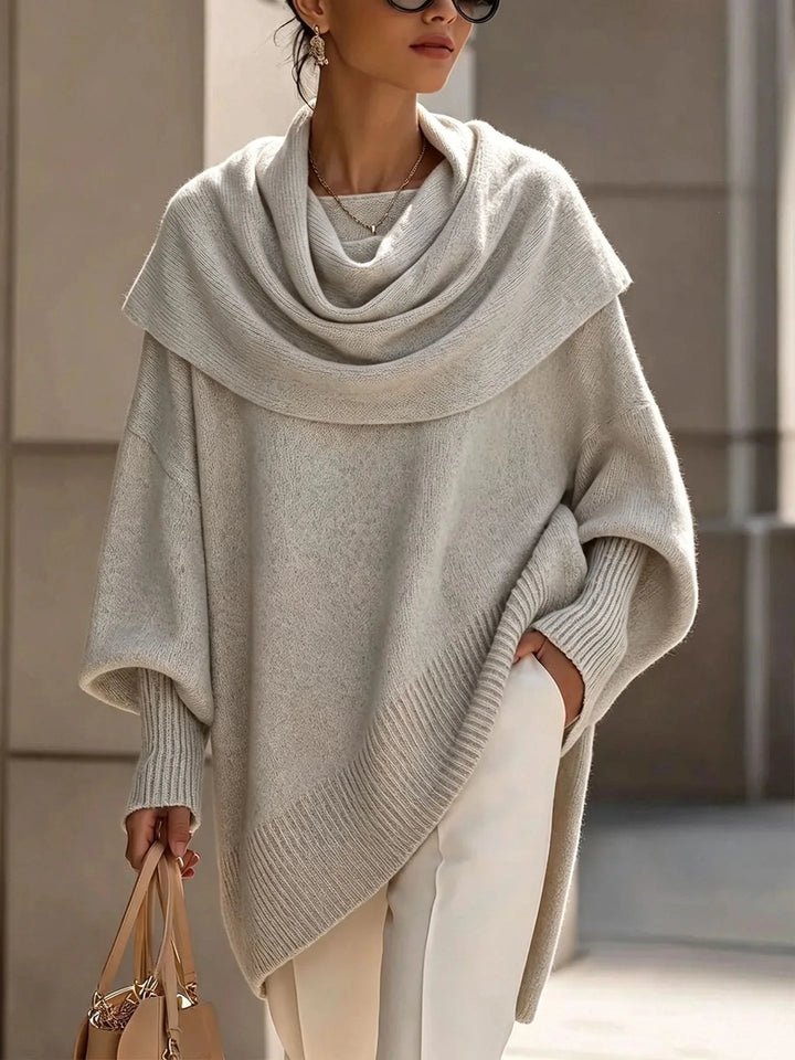 Woman wearing gray draped scarf collar poncho sweater