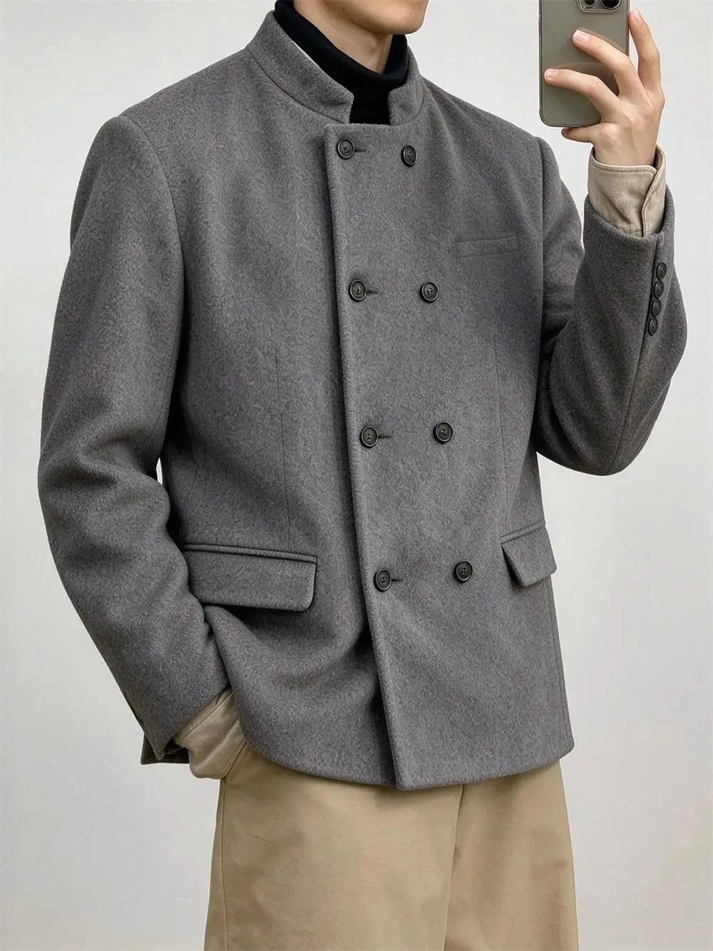 Man wearing grey mandarin collar double-breasted coat