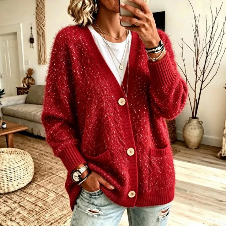 Woman wearing red sequin eyelash-knit cardigan with pockets