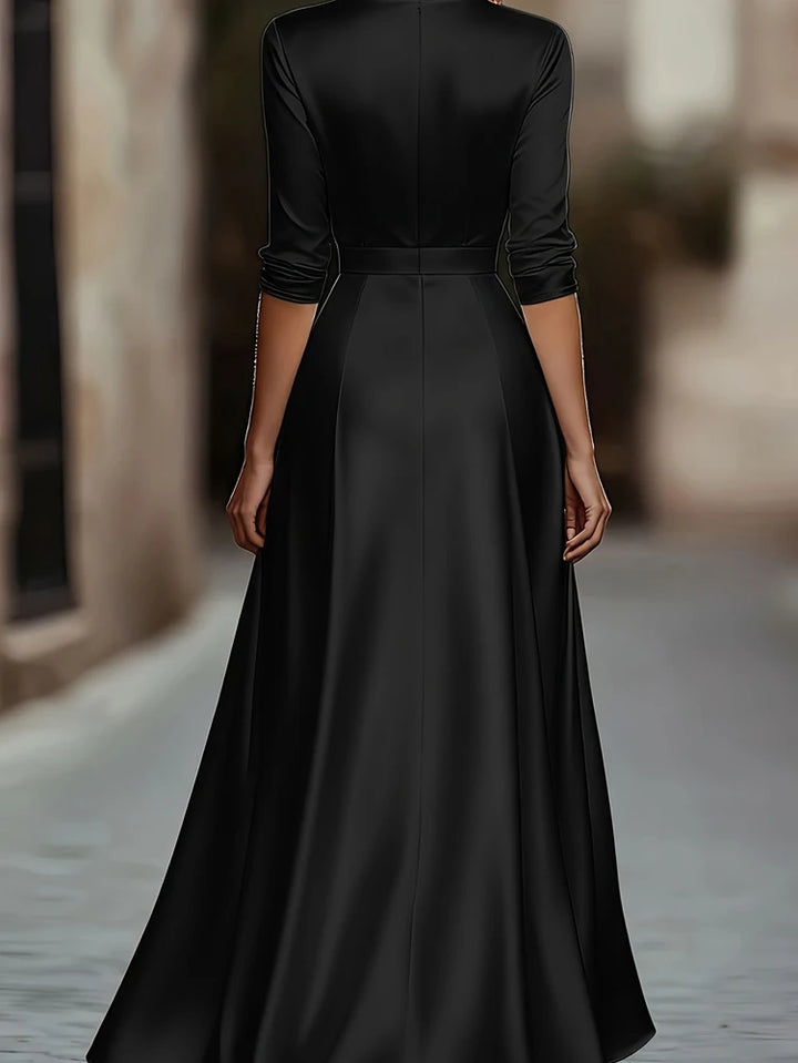 Black satin maxi dress, back view showing A-line skirt