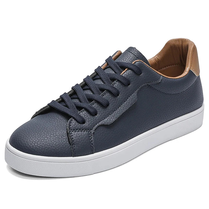 Navy blue sneaker angled front view showing toe and lace detail