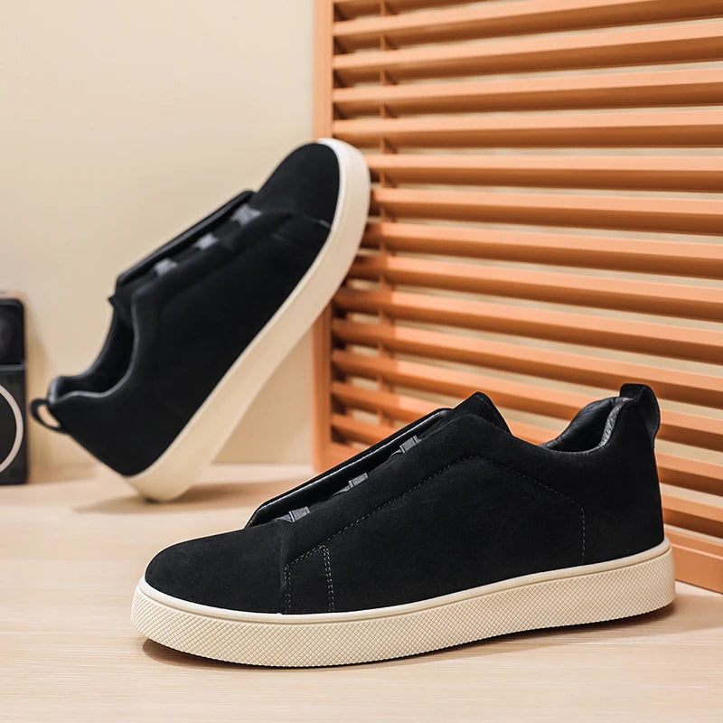 Pair of black suede-look low-top sneakers with elastic crisscross band