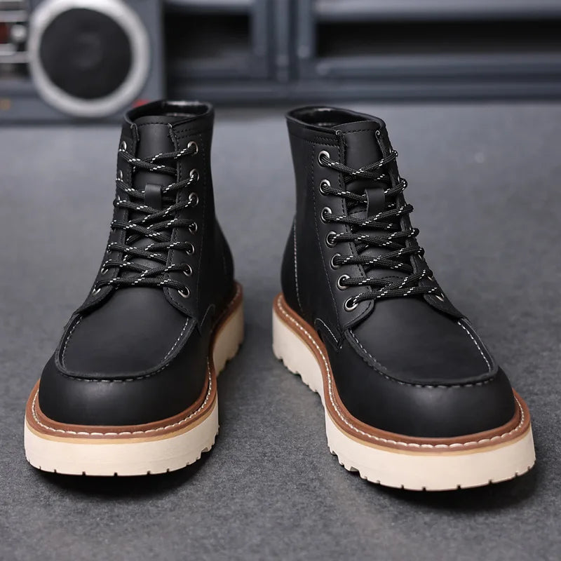Black leather moc-toe work boots with lace-up front, side view