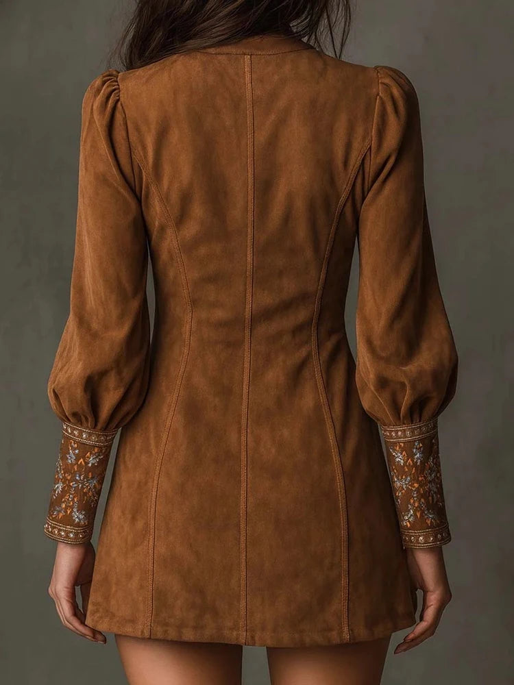Back view of brown suede-look mini dress showing seaming and cuffs