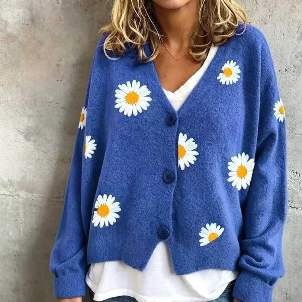 Woman wearing blue daisy embroidered cardigan