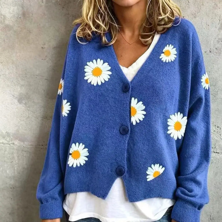 Woman wearing blue daisy embroidered cardigan
