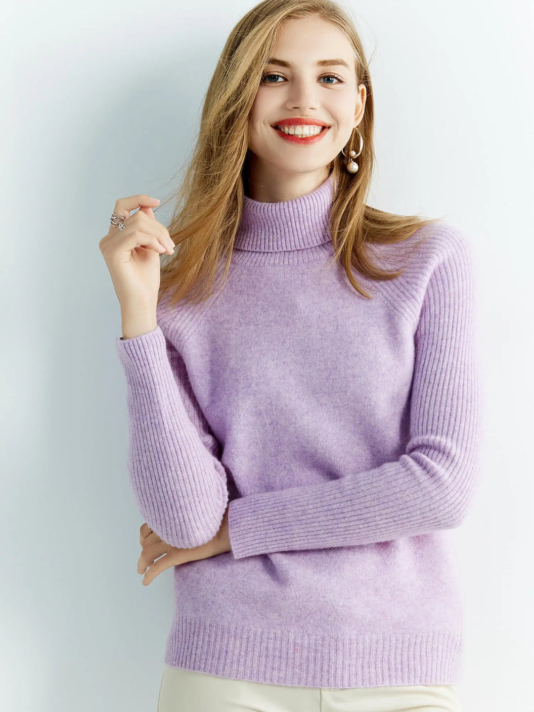 Smiling woman wearing purple turtleneck sweater