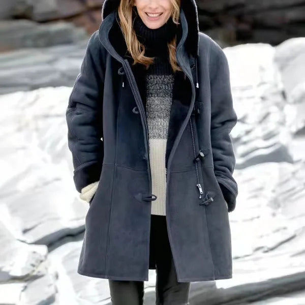 Model wearing charcoal duffle coat outdoors in snow