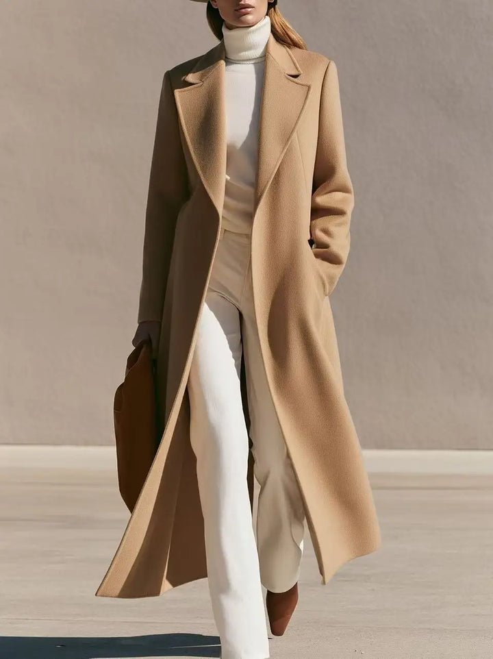Woman wearing long camel wool-blend coat with notched lapel walking outdoors