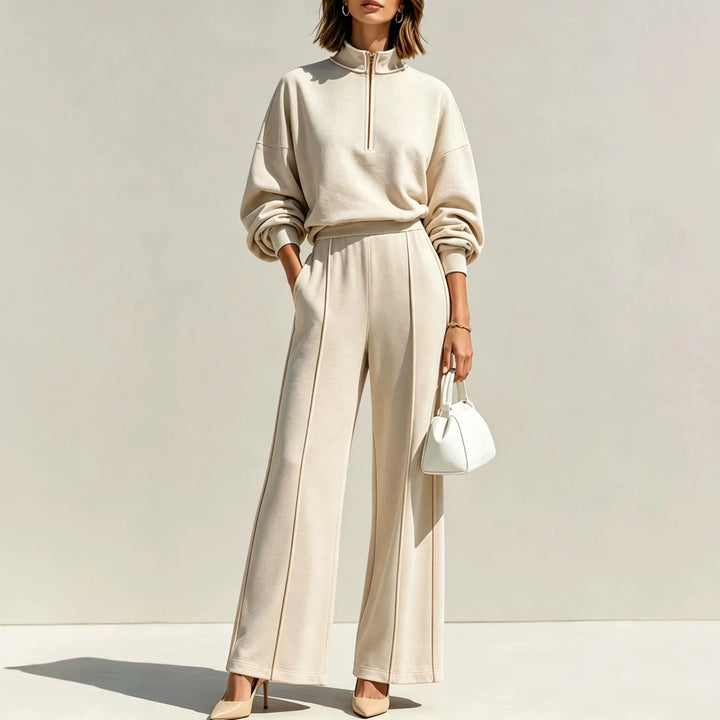 Woman wearing apricot half zip pullover and wide leg pants set, front view