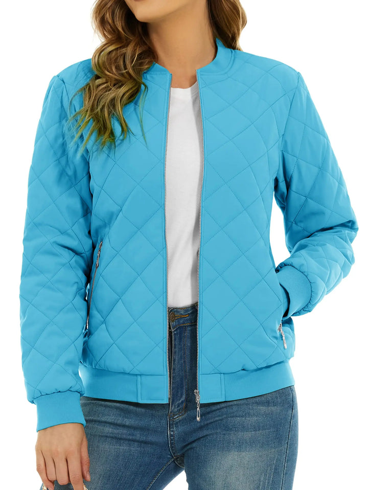Close up of ice blue quilted bomber jacket with zip pocket