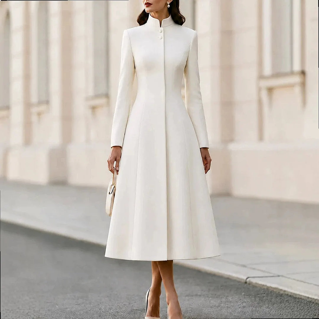 Woman wearing white stand collar coat dress with button front