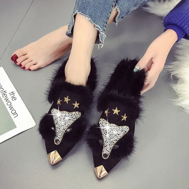 Black faux fur ankle boots with crystal fox face detail on model