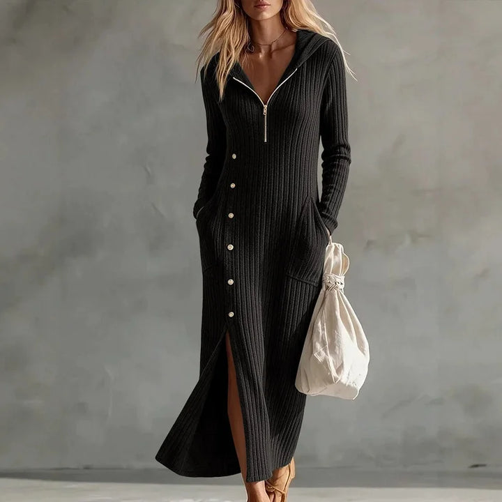Woman wearing black hooded ribbed knit maxi dress with button front detail