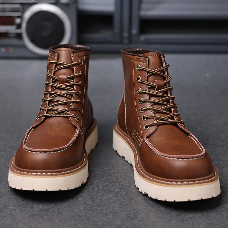 Pair of brown leather lace-up ankle boots, front angle