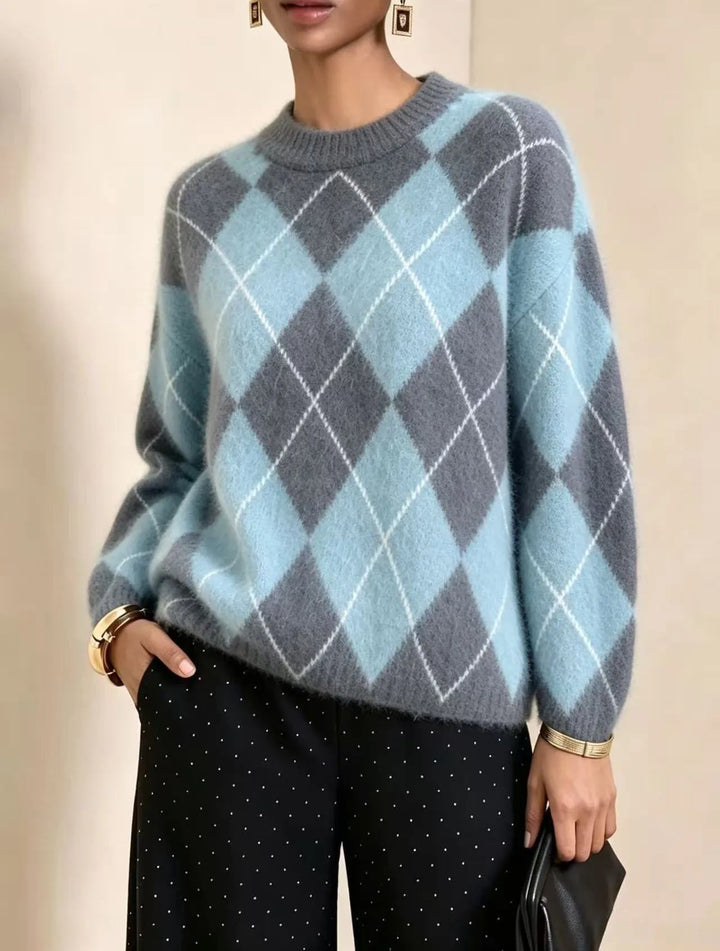 Close up of sky blue and gray argyle knit sweater