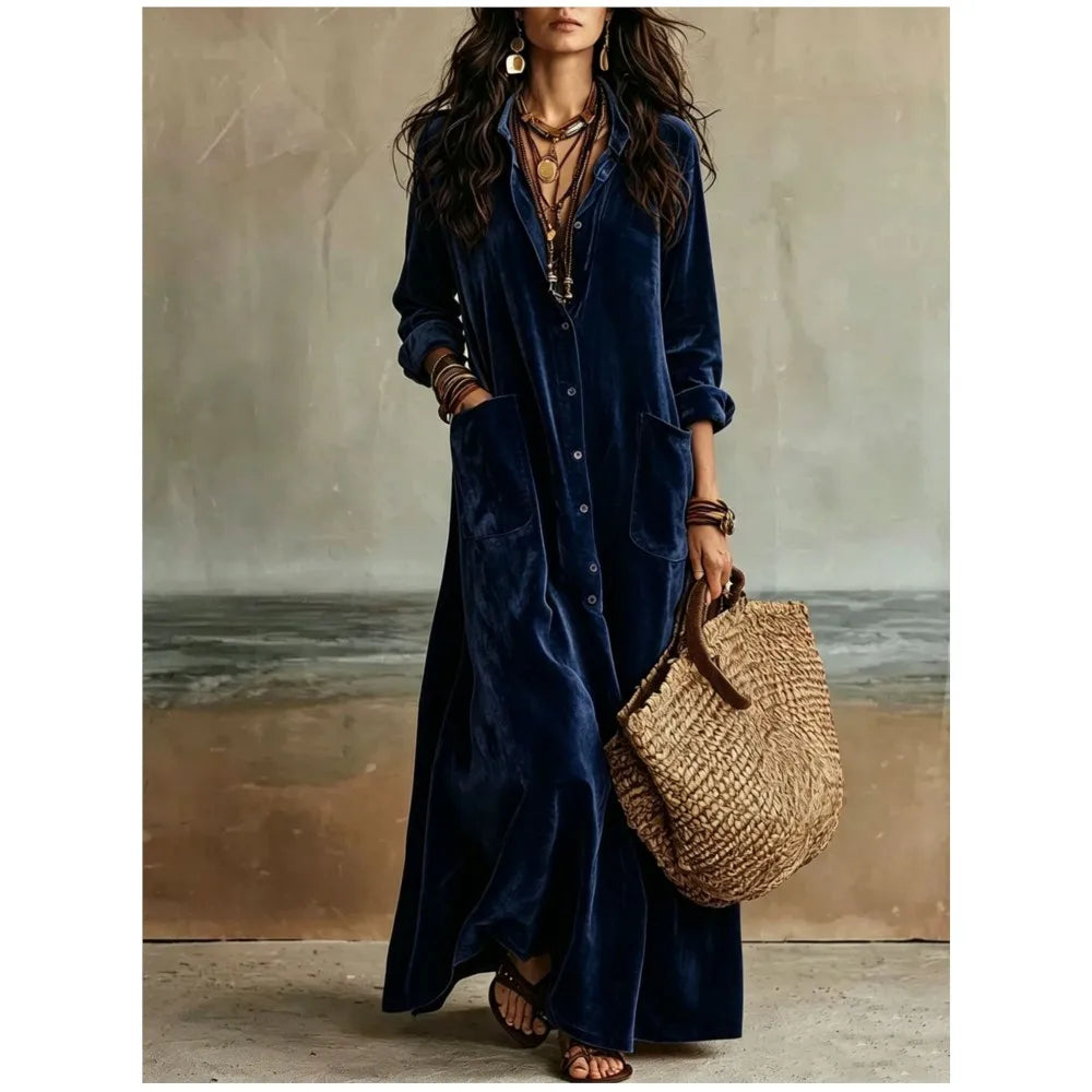 Woman wearing navy blue velvet button front maxi dress with patch pockets