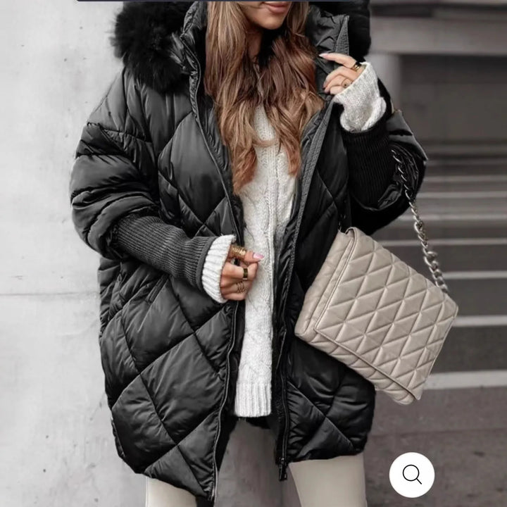 Woman wearing black diamond quilted puffer coat with faux fur hood