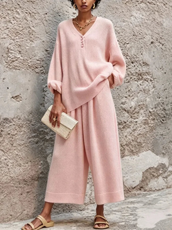 Woman wearing pink ribbed knit sweater and wide leg pants set