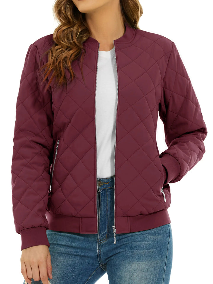 Close up of wine red quilted bomber jacket with zip pocket